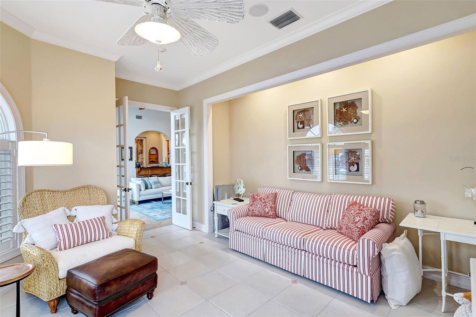 Double Glass Doors Opens Up To A Large Bedroom.