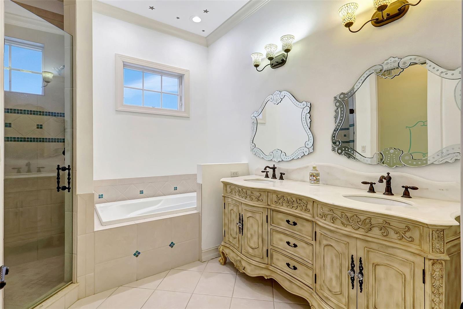 This Lovely Bathroom Features An Ornate, Double Sink Vanity, Deep Tub, Separate Shower And Private Water Closet.
