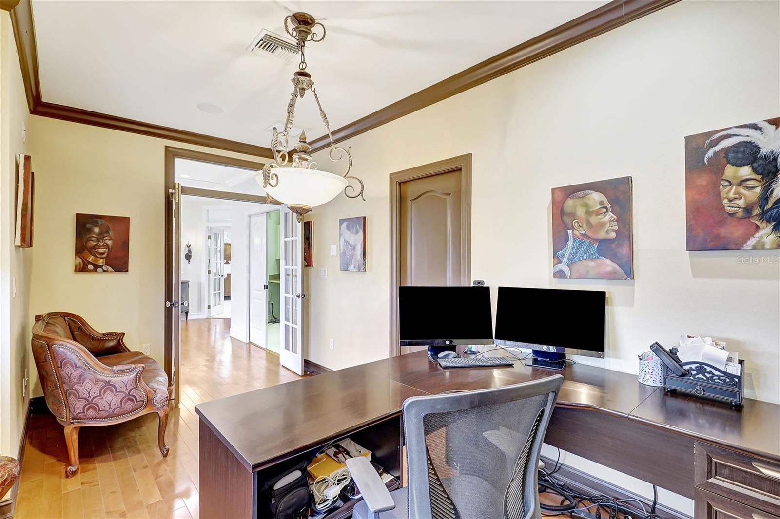 A private upstairs office featuring rich wood floors and a quiet atmosphere—perfect for focused work.