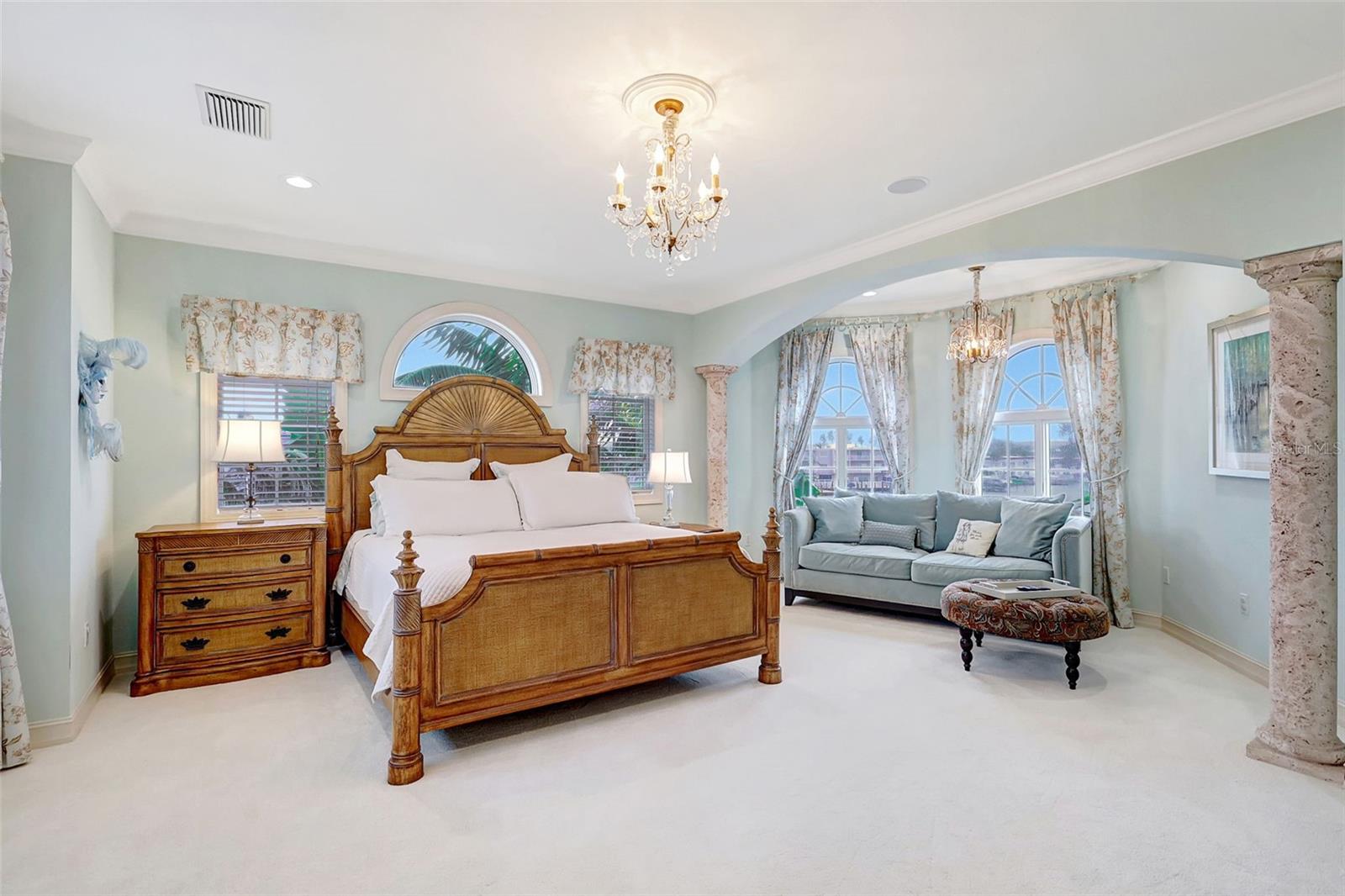 The expansive primary suite, situated privately on the third floor, offers breathtaking water views and unmatched seclusion.
