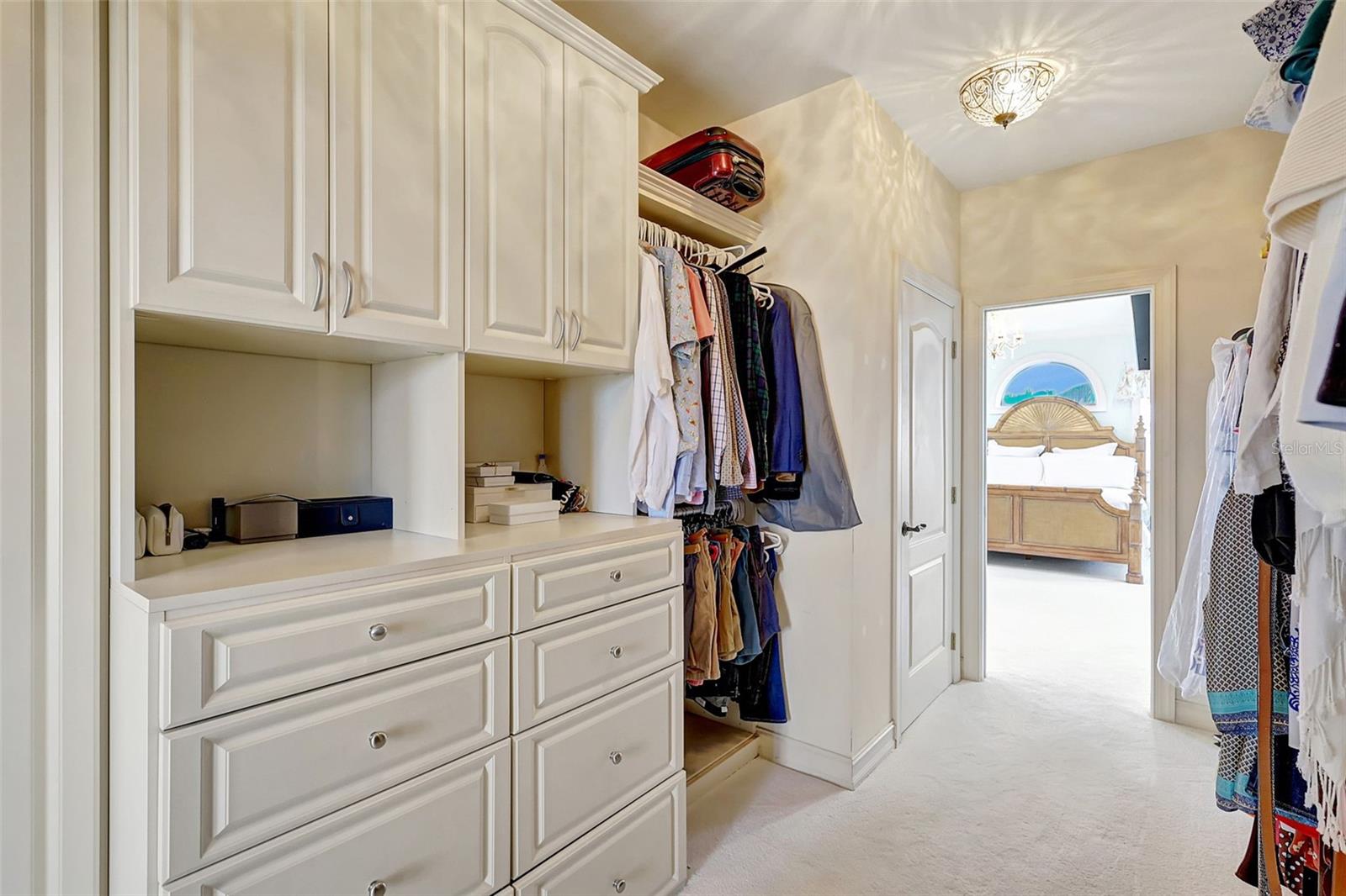 There is no shortage of space in this wonderful walk in closet.