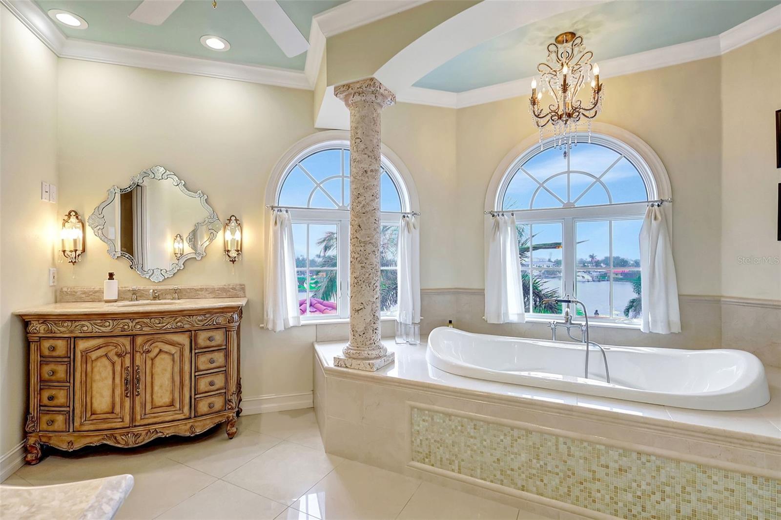Unwind in the deep tub while enjoying serene water views.