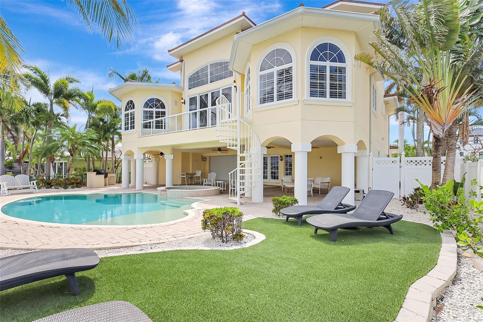 The backyard is spacious offering a lounging area.  Relax, it's your time to live the Florida lifestyle!