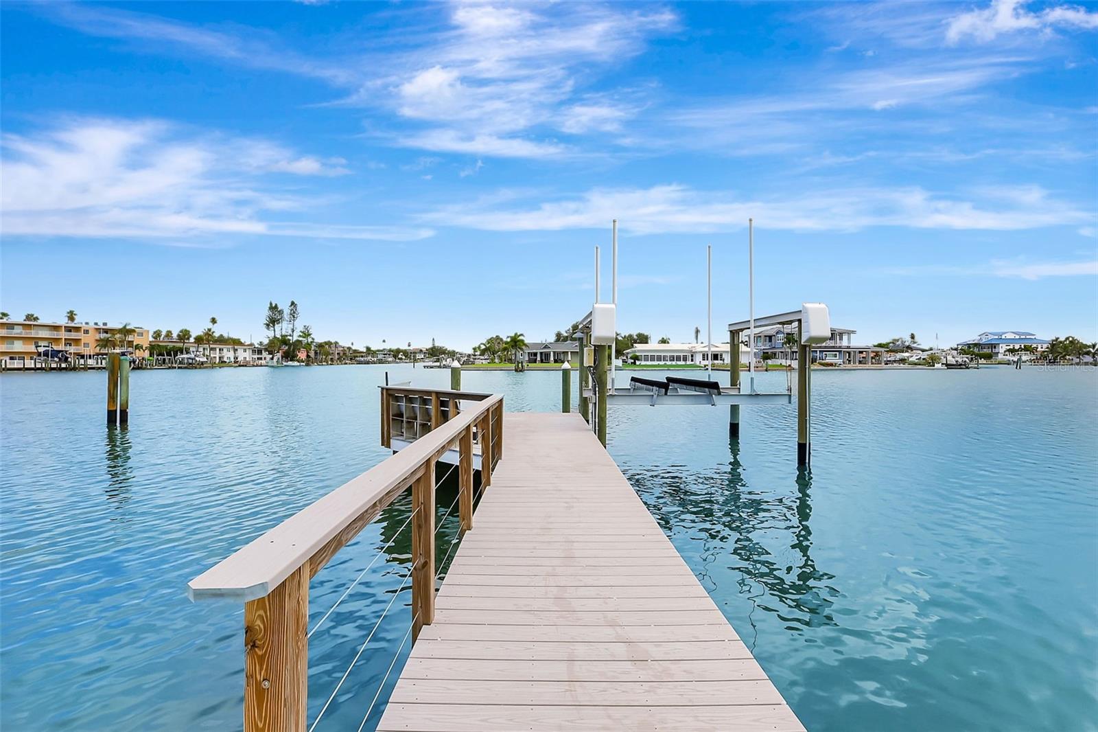The extended composite dock leads out to a bench area.  Deep water and easy access to the Intracoastal & Gulf waterways!