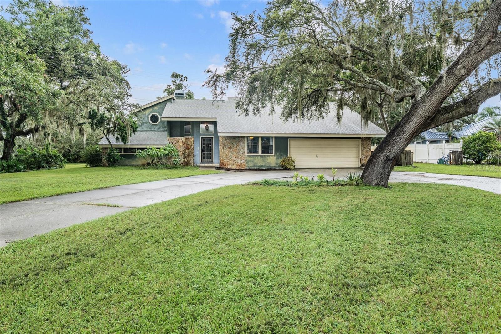 Front of home with circular driveway