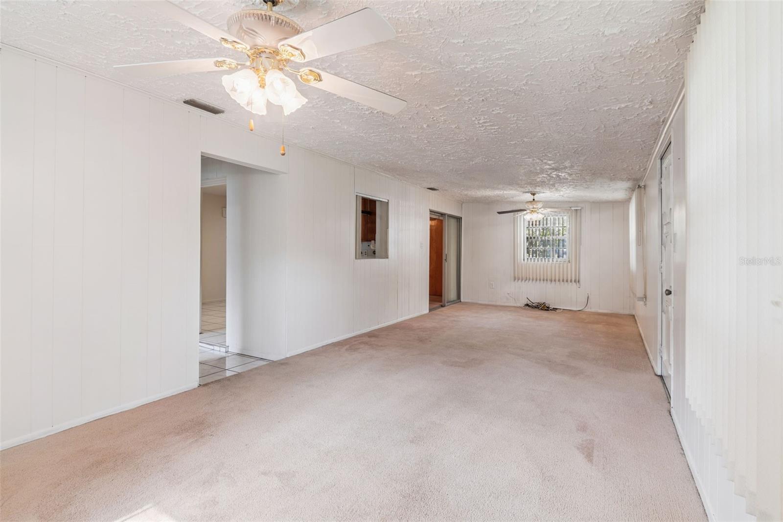 Den with ceiling fans
