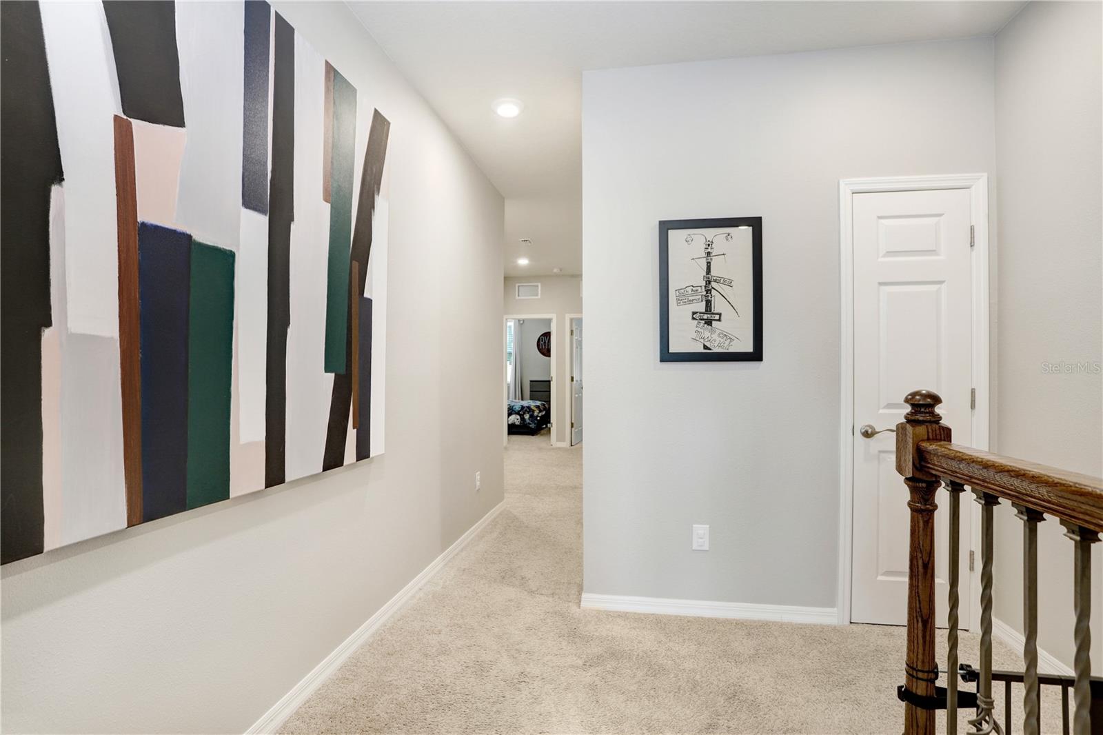 Hallway from Owner's Suite to Loft & Secondary Bedrooms