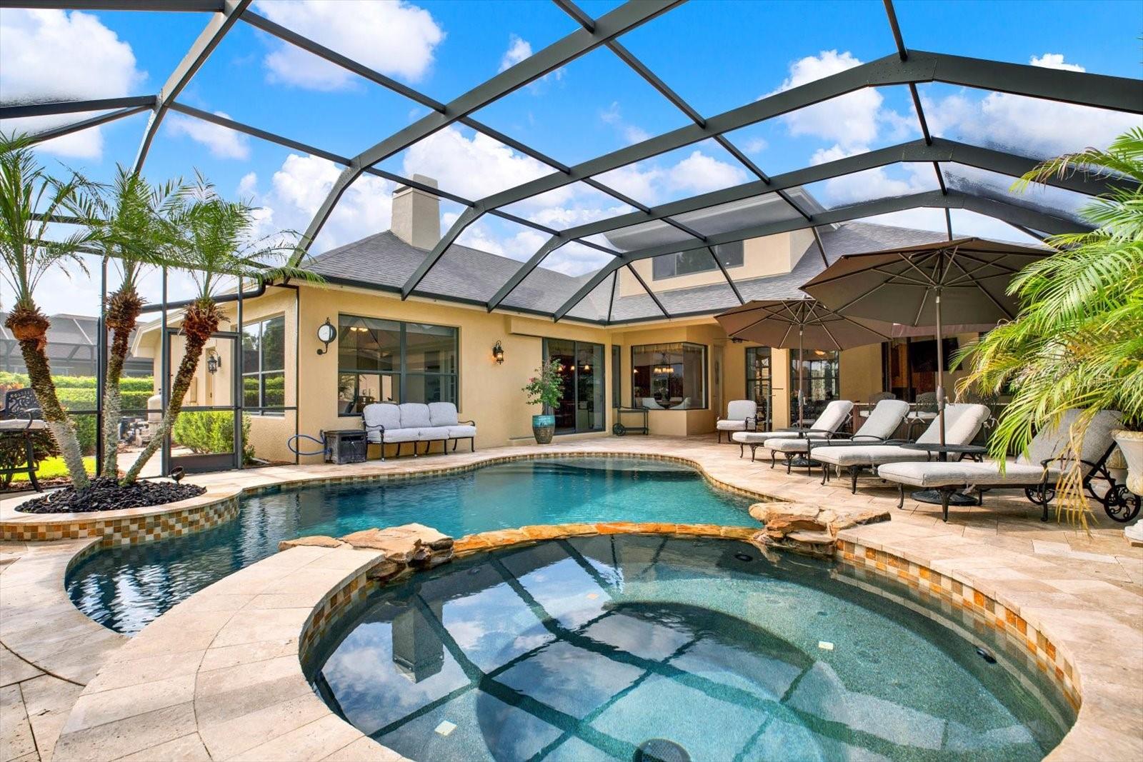 Pool area with spa and outdoor kitchen