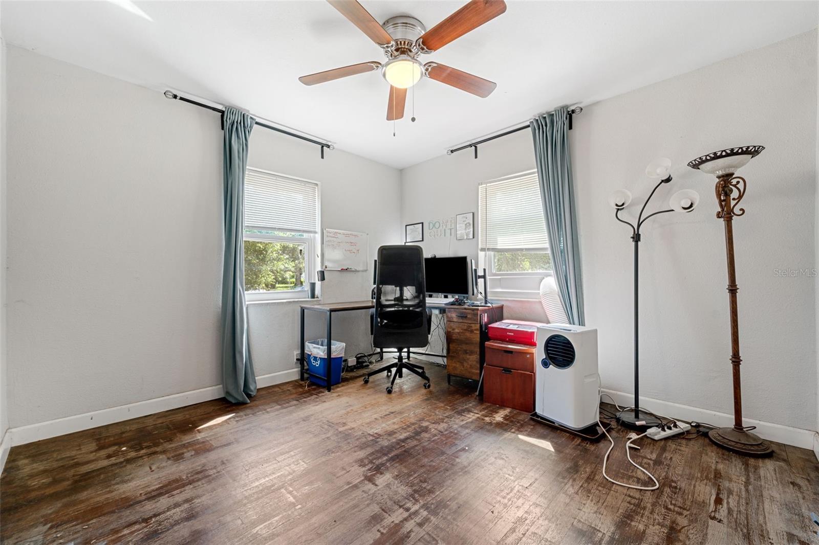 Bedroom 2 with two large windows