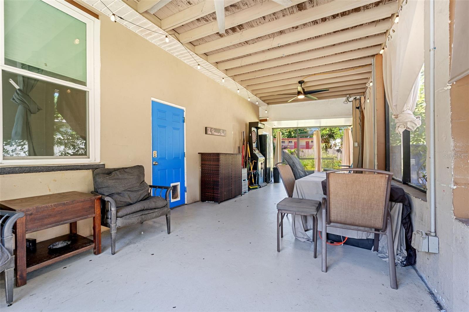 With privacy shades, screening and ceiling fans, this is a great entertaining area!