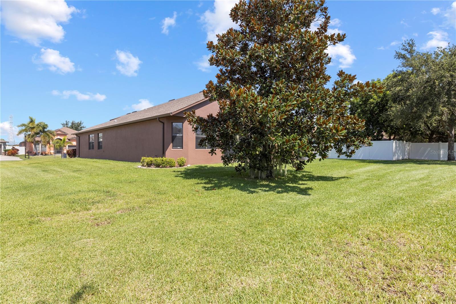 large corner lot, perfect for backyard entertaining.