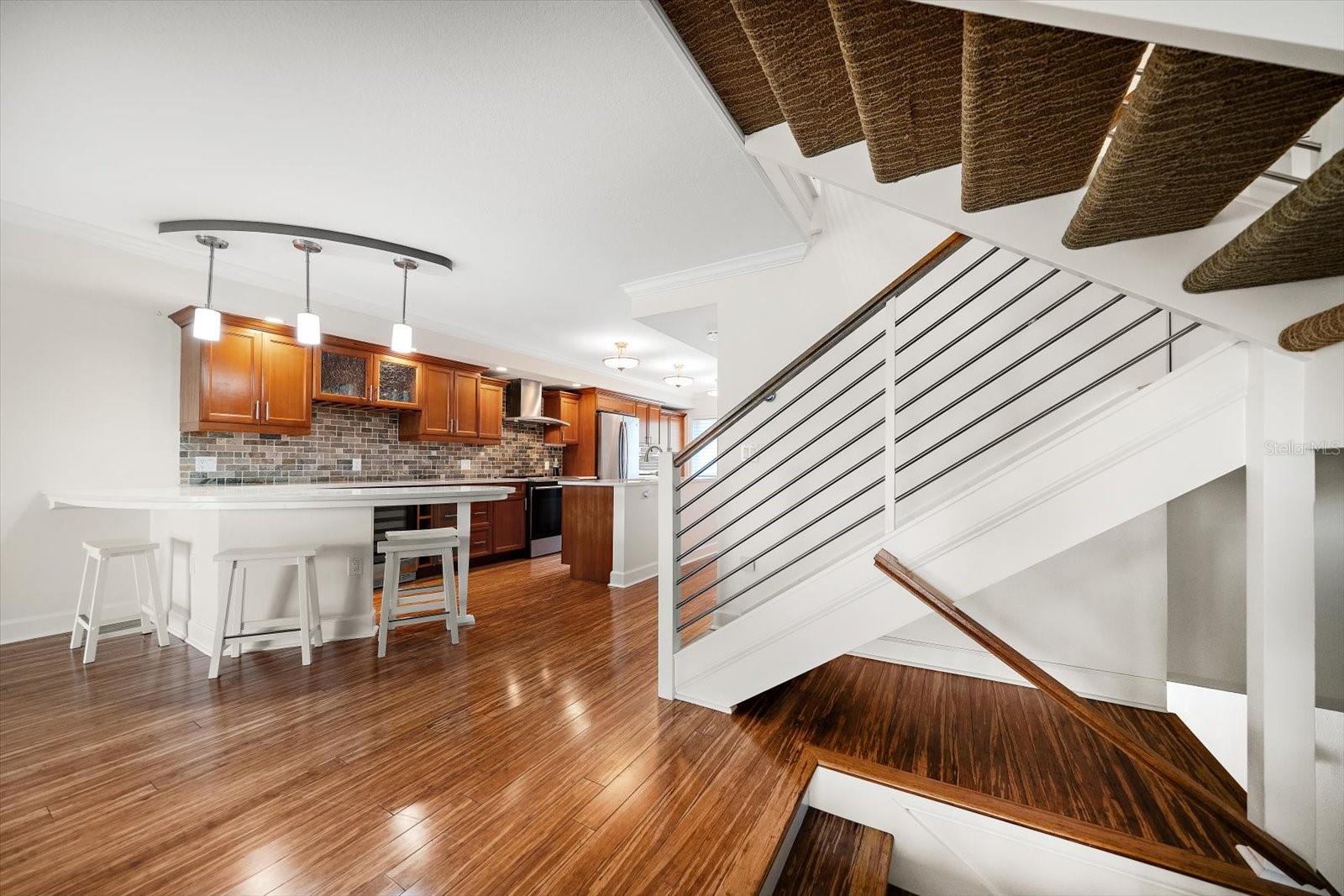 Modern finishes are found throughout include attractive staircase railings and bamboo flooring.