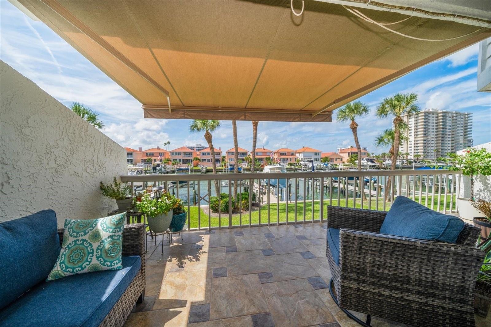 Expansive porch with retractable awning.