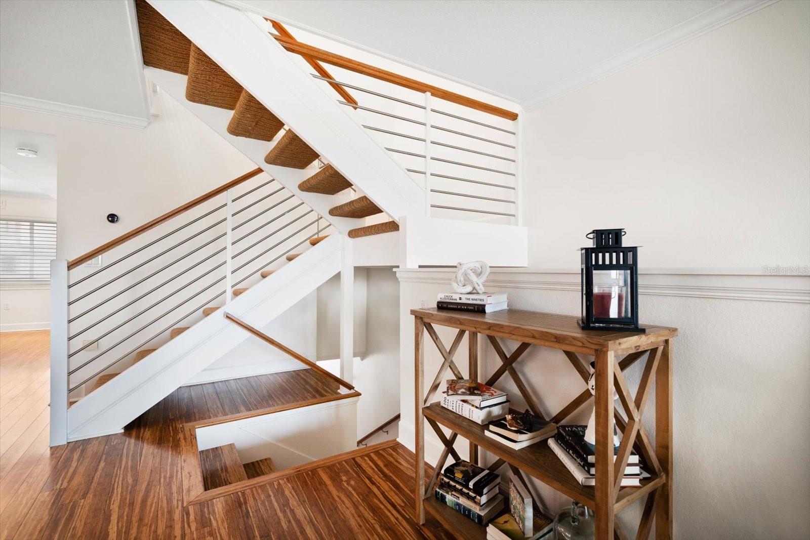 Staircase leads to master and additional bedroom upstairs.