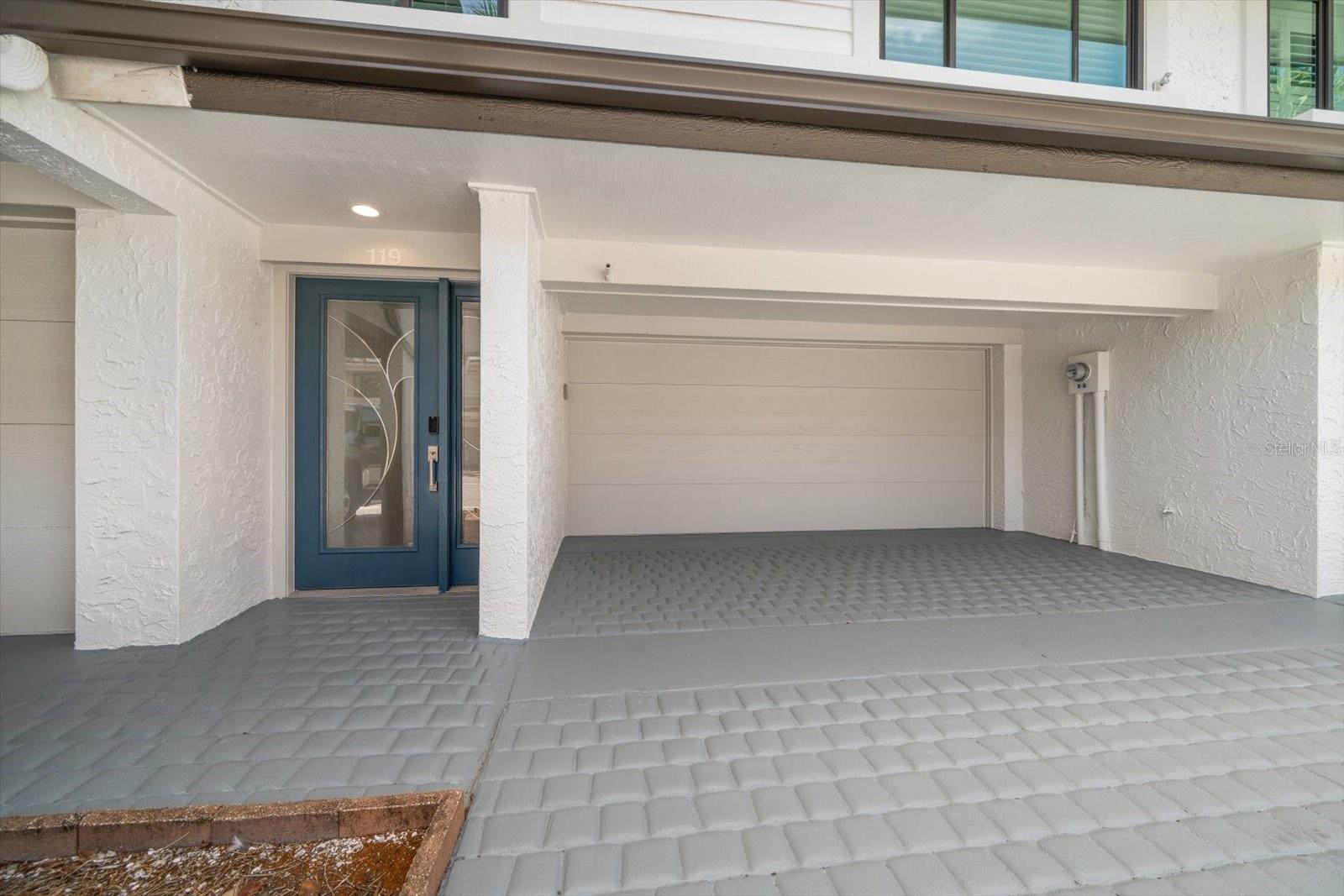Two car garage and additional parking in driveway.