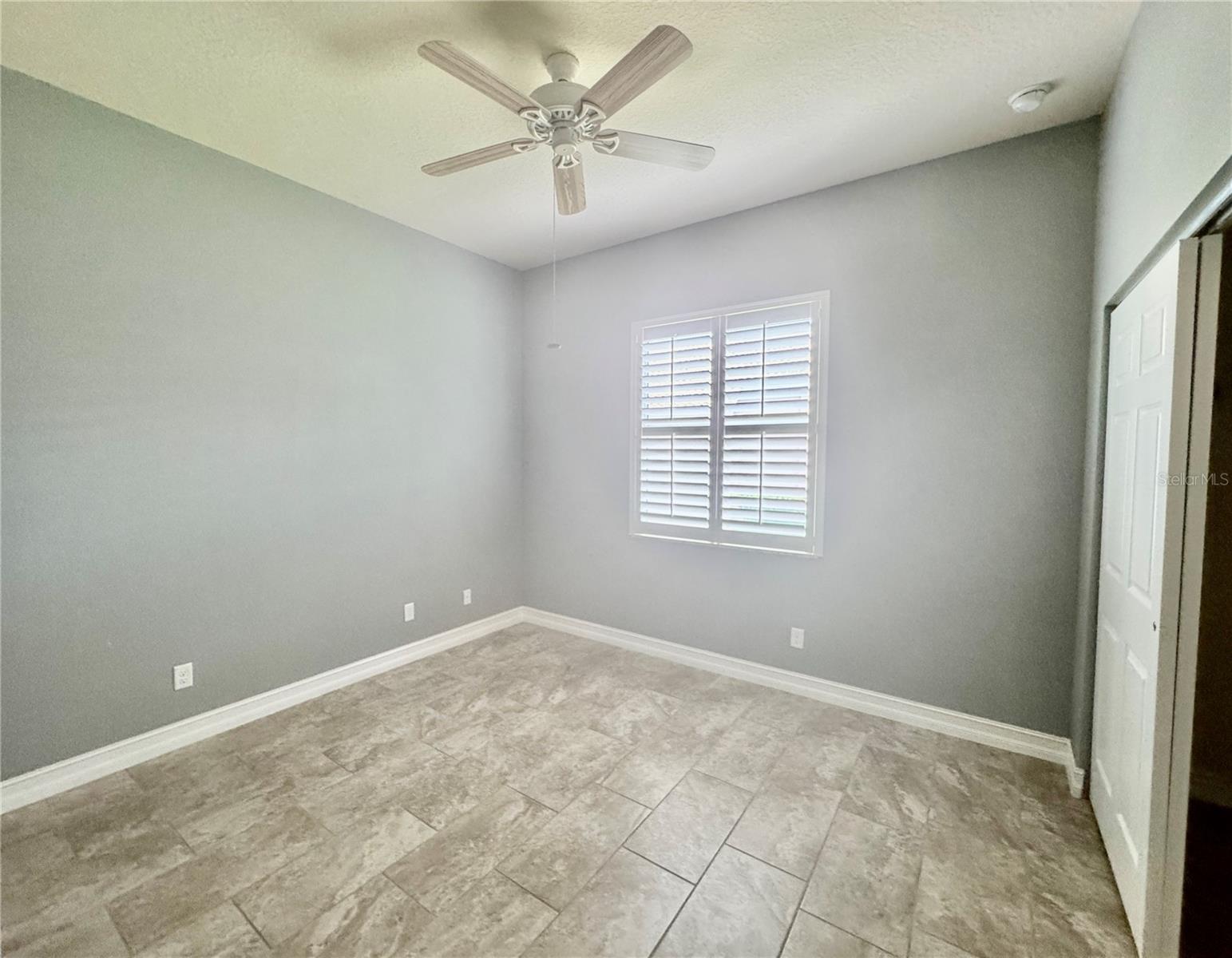 SECOND BEDROOM W/NICE PORCELAIN TILED FLOOR
