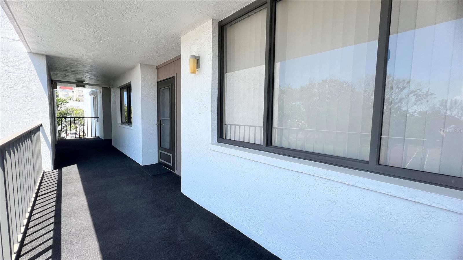 Open front entrance hallway to stairway