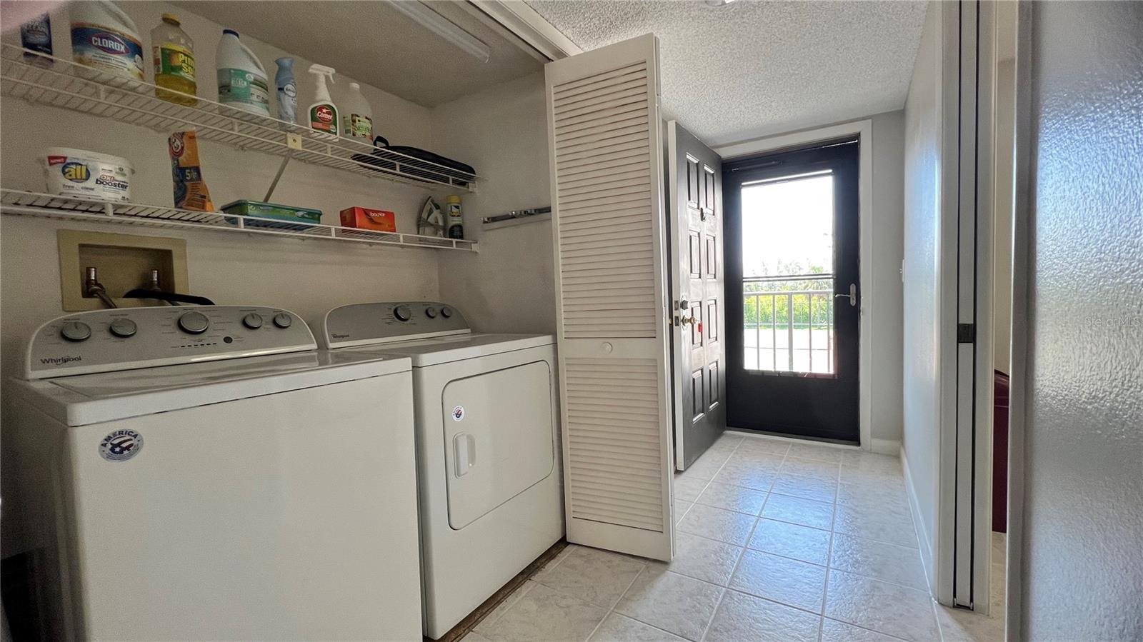 Entrance hallway inside washer and dryer closet
