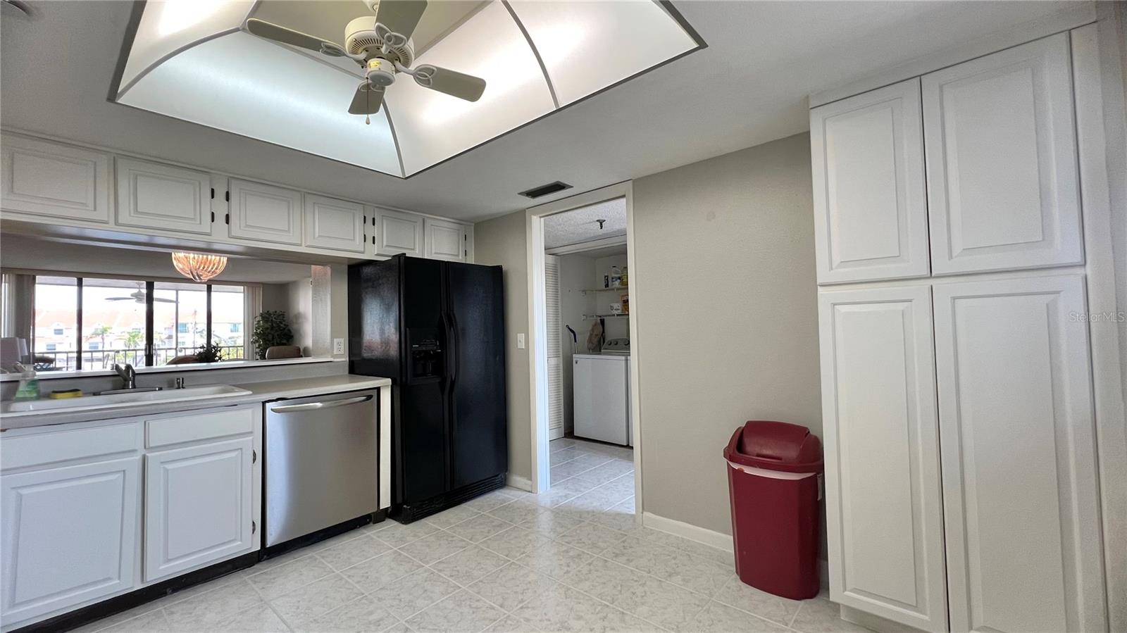 Kitchen has pocket door to close off the rest of the condo