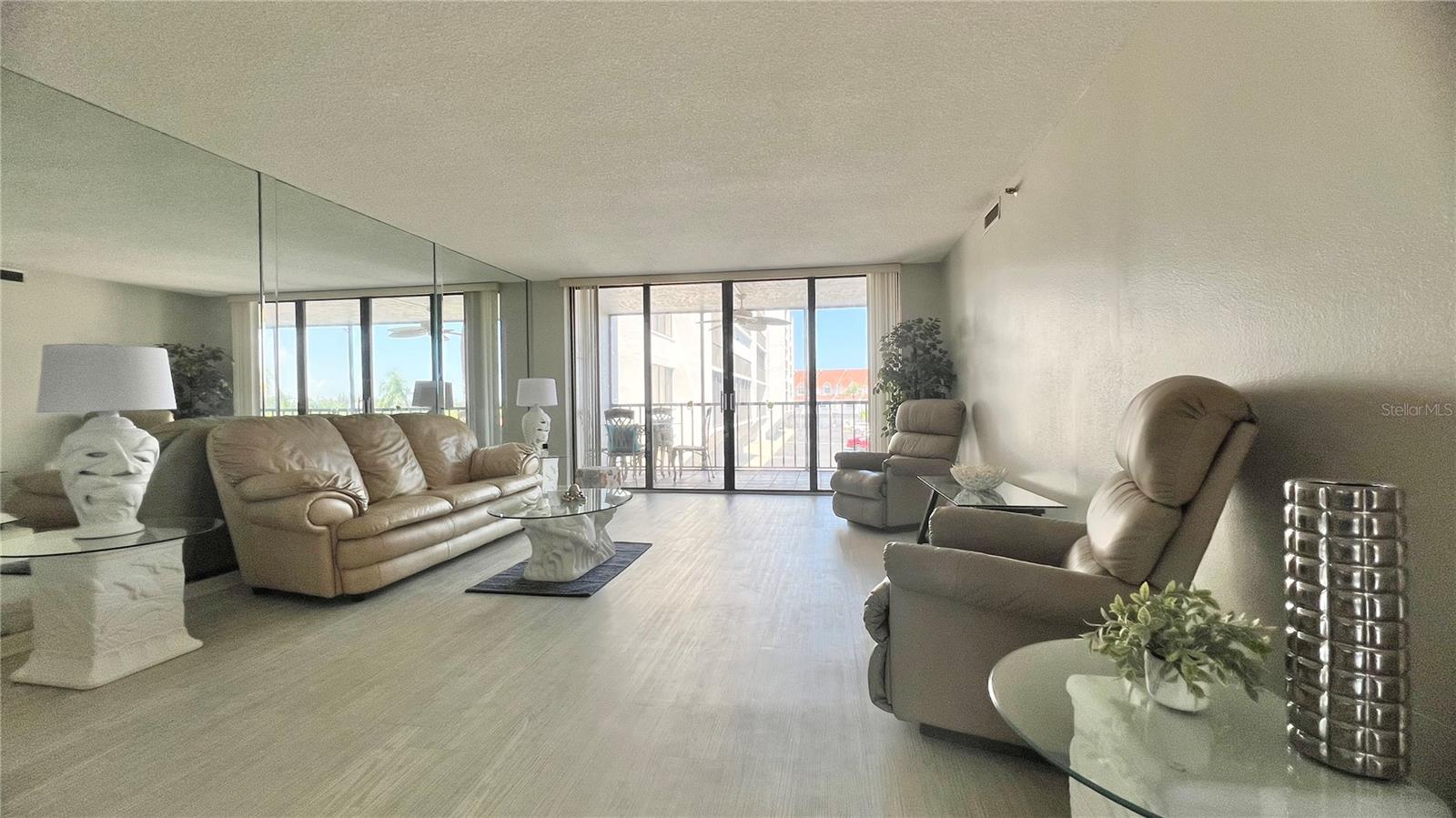 Large sliders out to the balcony/screened lanai