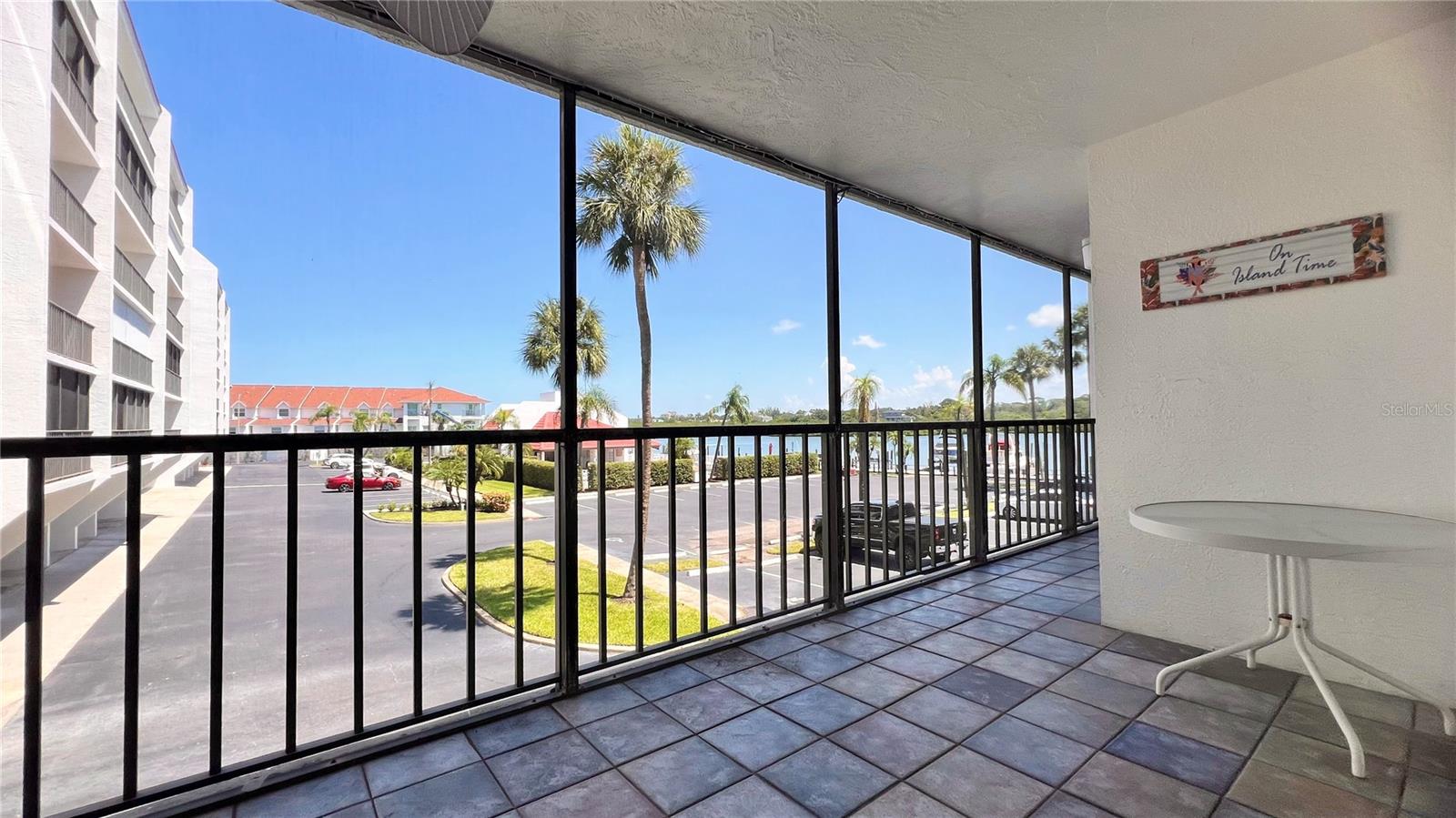Screened lanai/balcony overlooking pool and water view