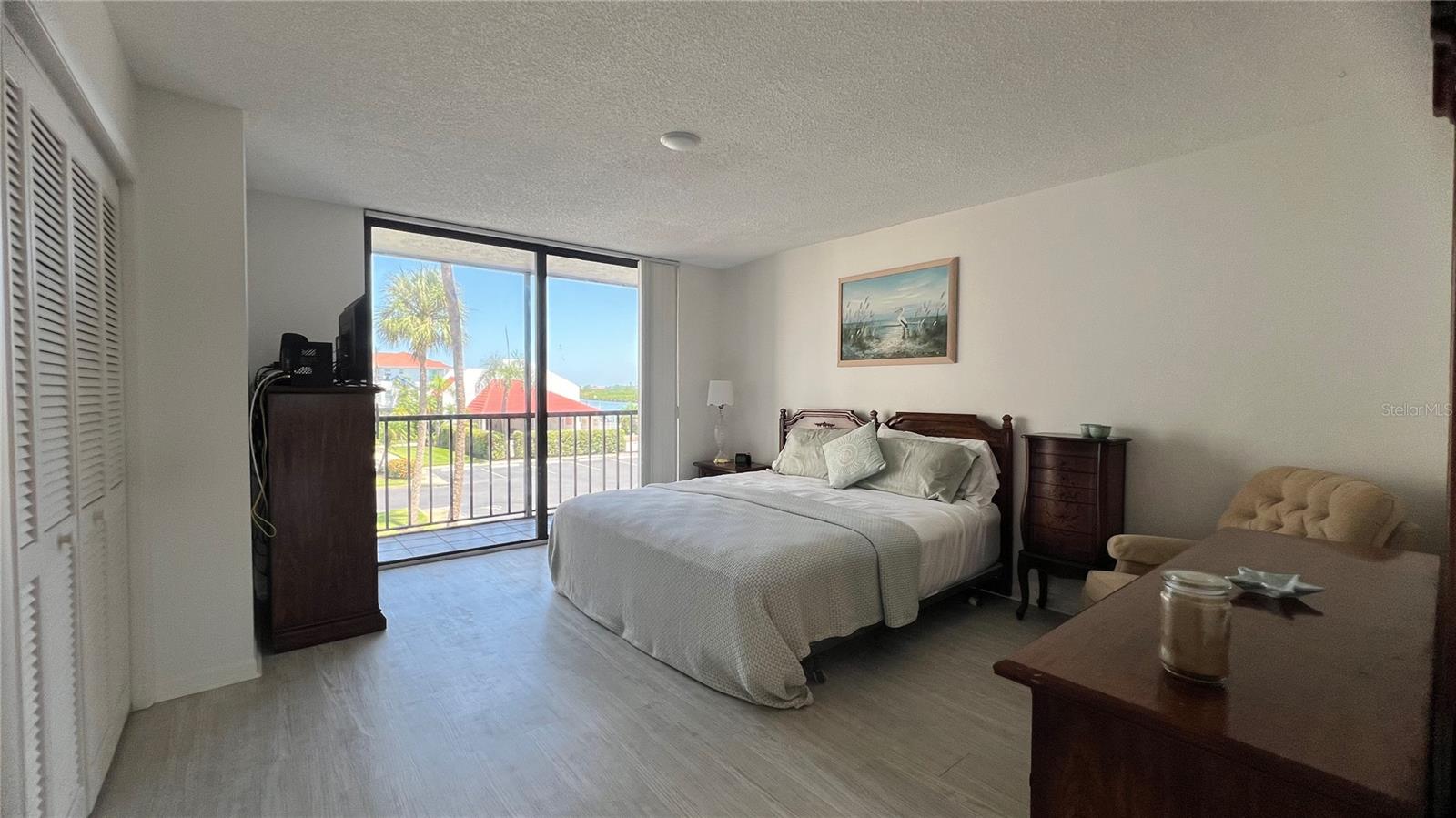 Primary bedroom with balcony