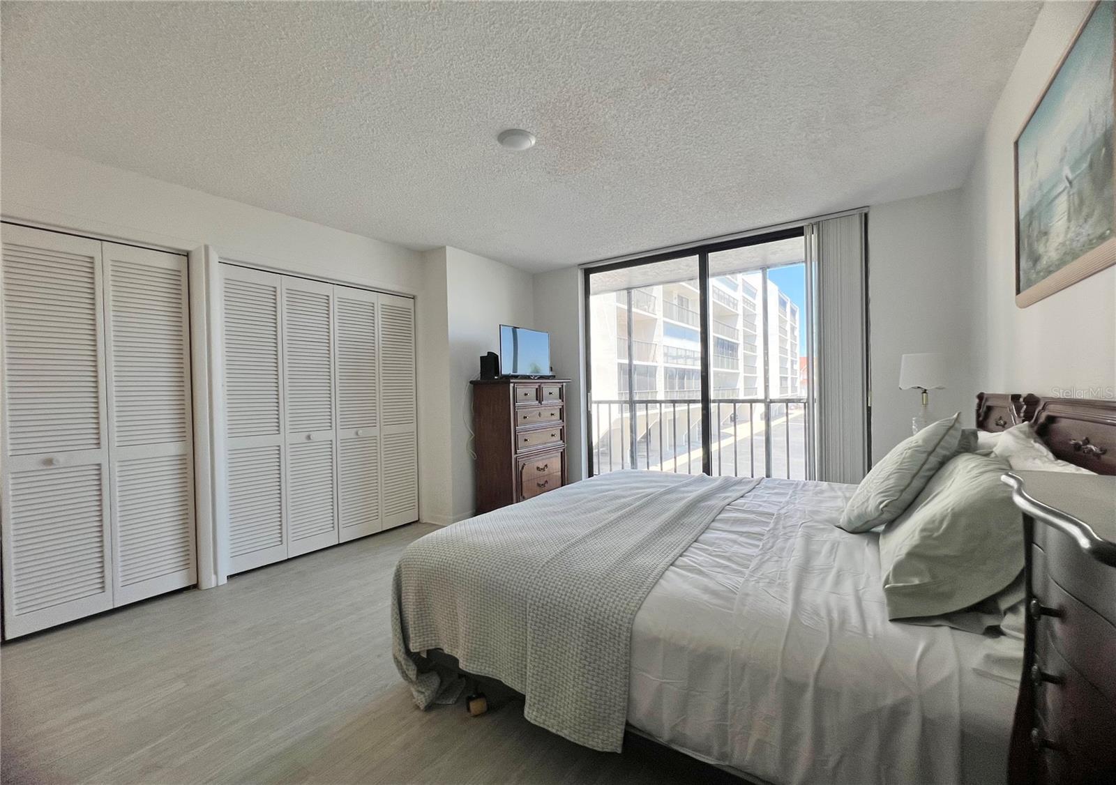Primary bedroom with balcony