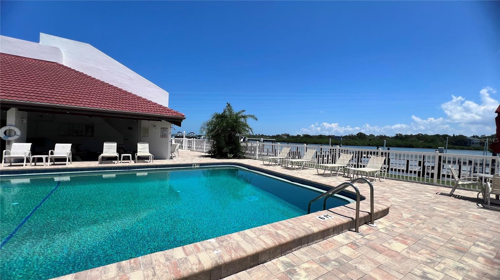 Community pool with water view