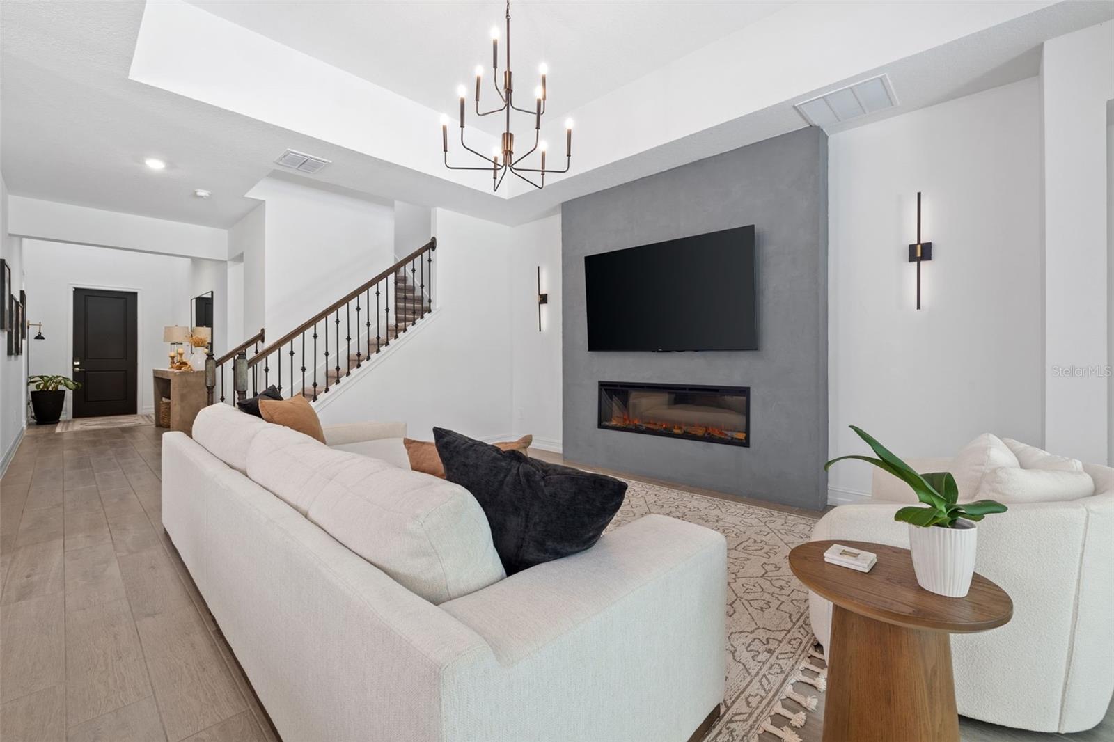 Beautiful Living Room with Custom Fireplace & Coffered Ceiling