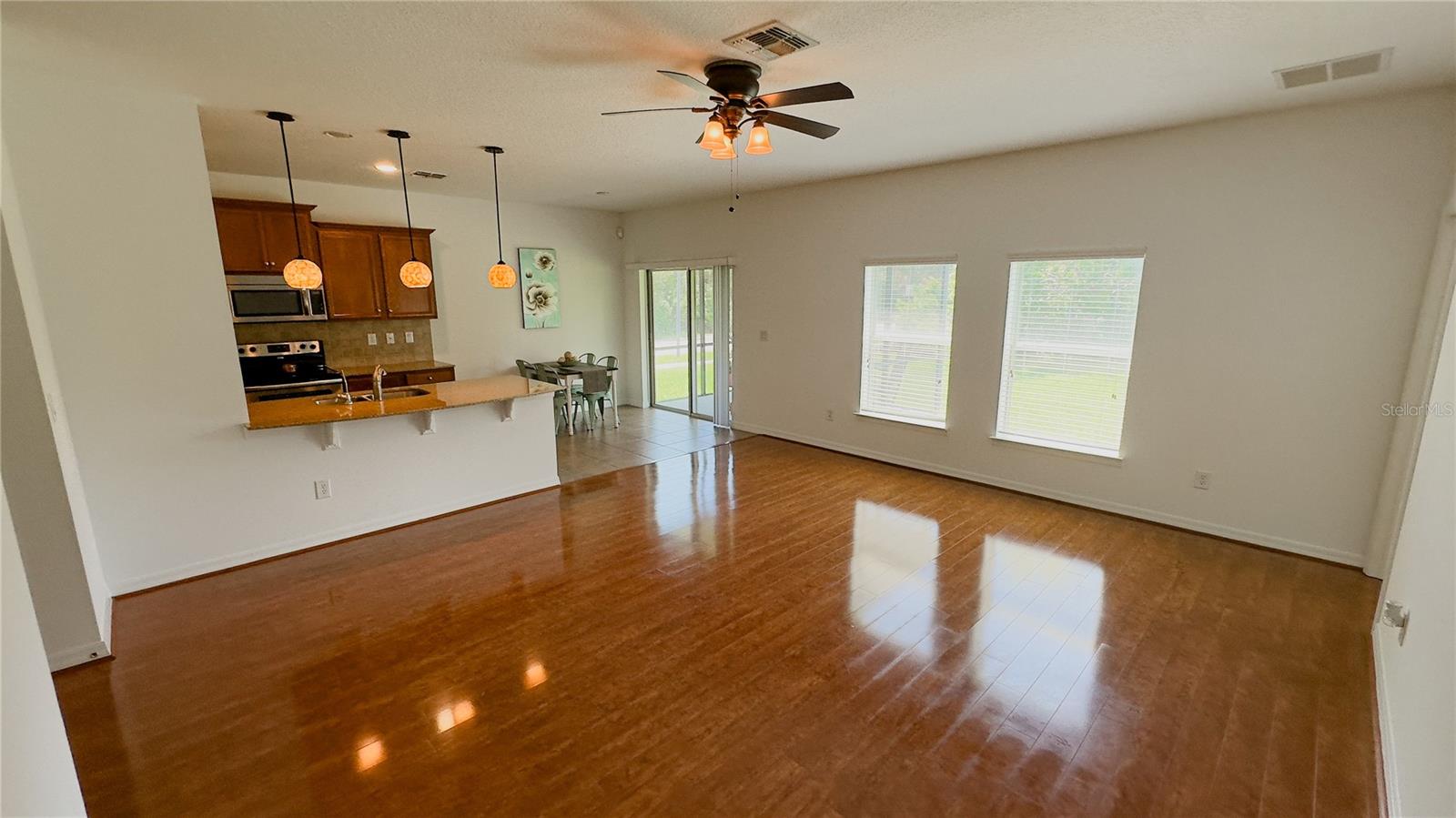 Living Room looking out to kitchen and backyard