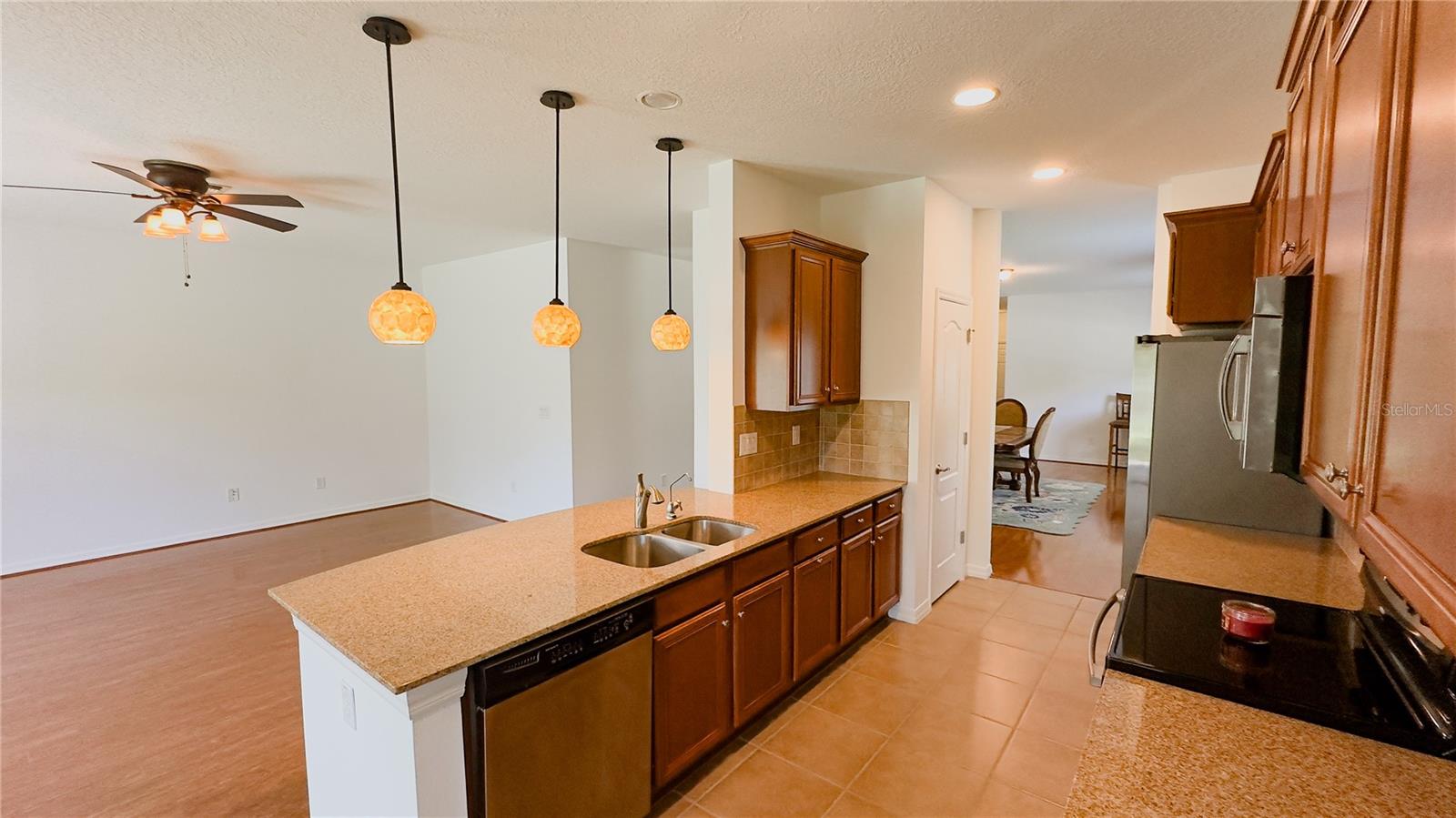 New pendant lights, granite counters, closet pantry, dishwasher and double sinks