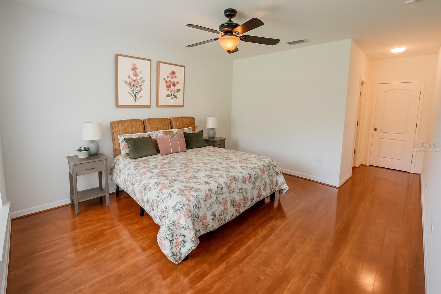 VIRTUALLY STAGED ARTWORK ON WALL & 1 SIDE TABLE LAMP...Master Bedroom large enough for a King Bed and other furniture
