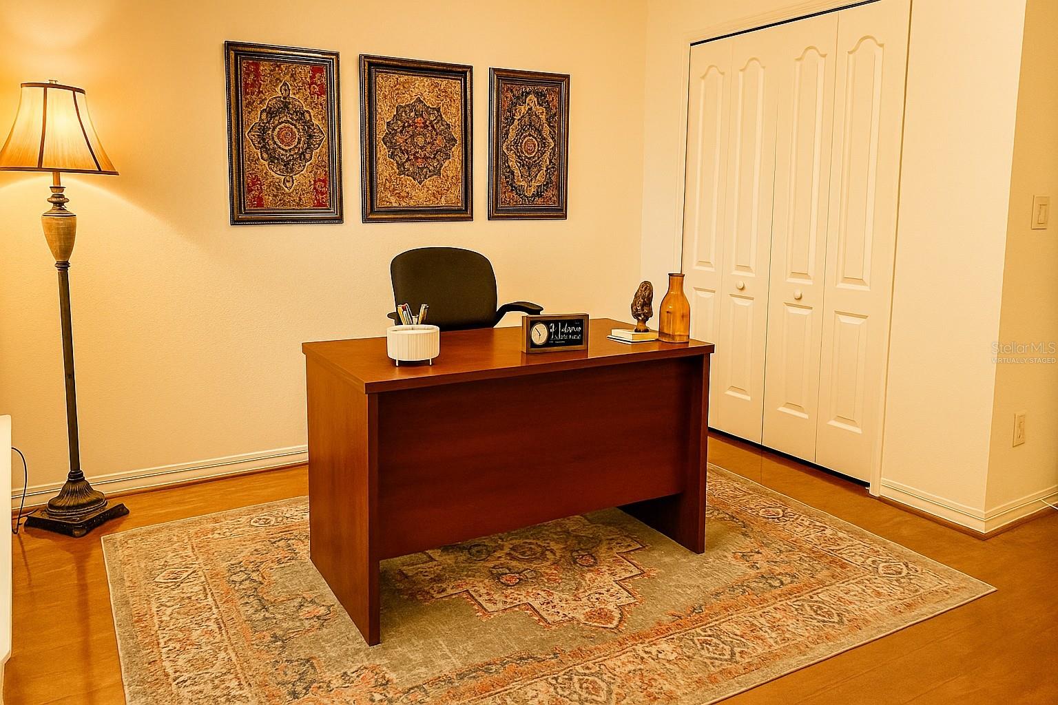 VIRTUALLY STAGED ARTWORK ON WALL in Bedroom 1 staged as a home office