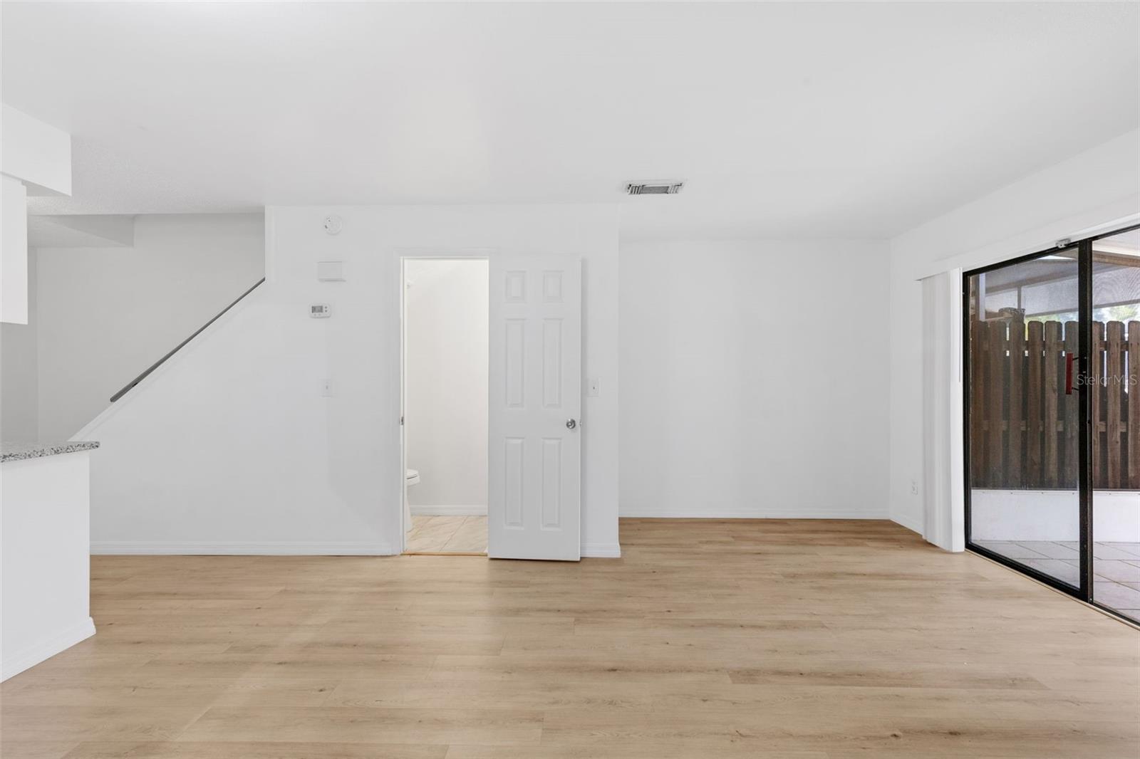Living R. Sliders to Enclosed Patio