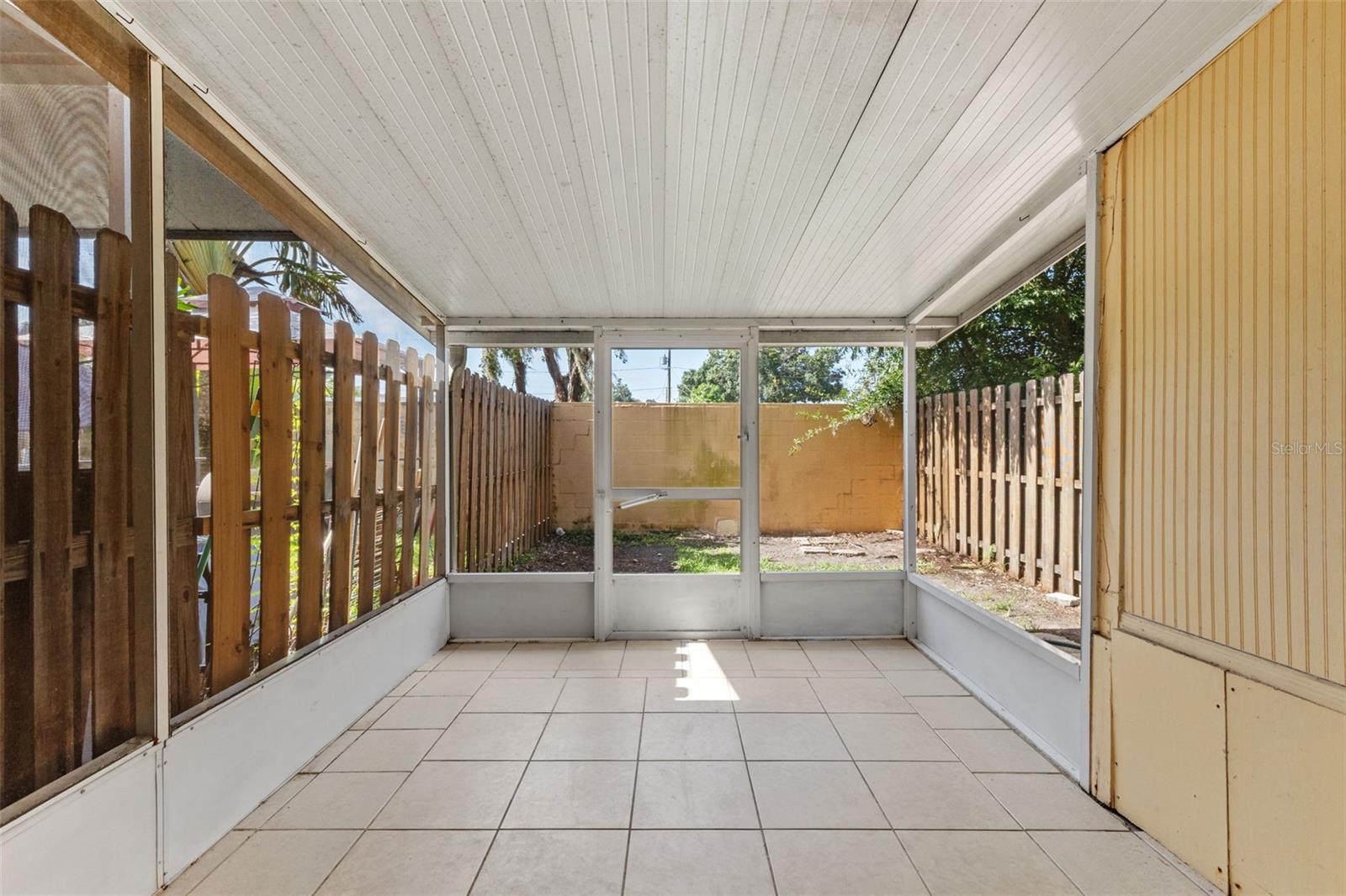 Enclosed patio to fenced in back yard