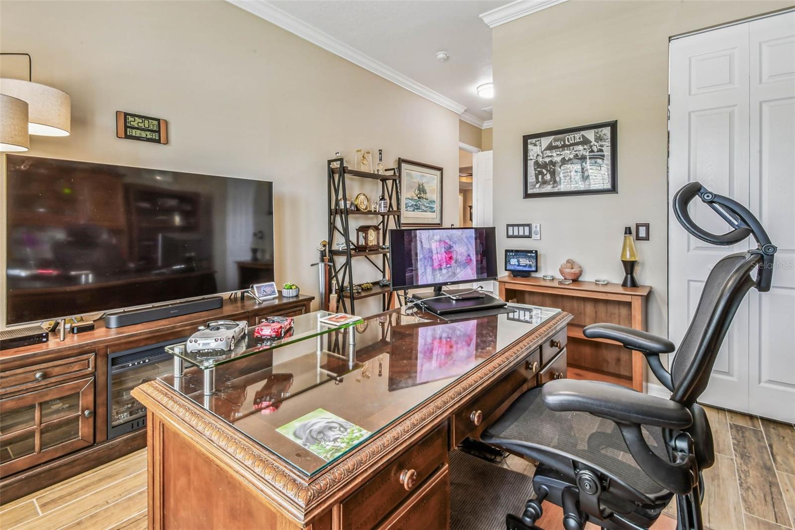 Used as secondary office, this bedroom has two closets