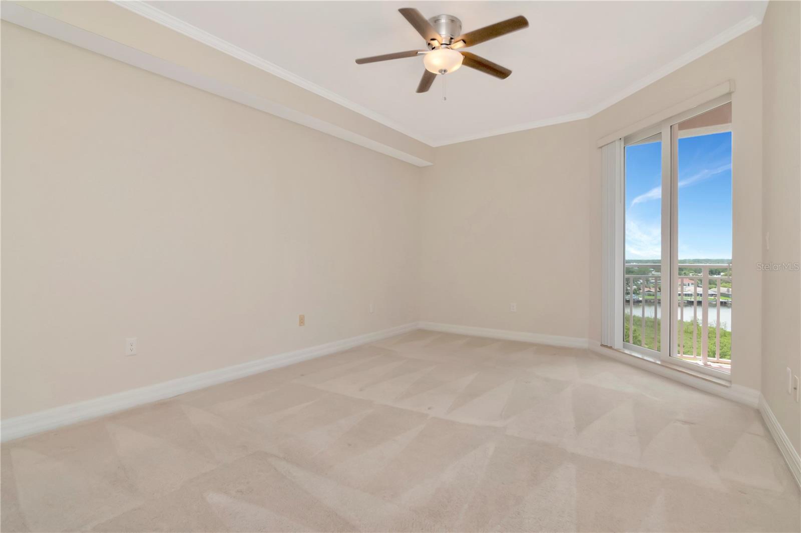 Master Bedroom w/ Water View & Private Balcony Access