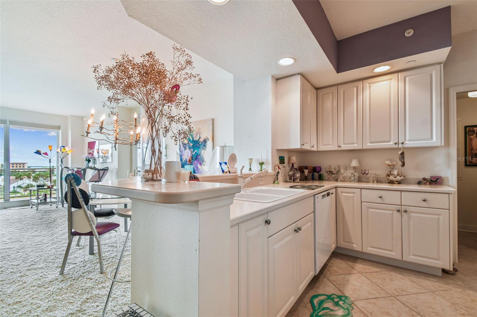 The Kitchen overlooks the Great Room and water beyond