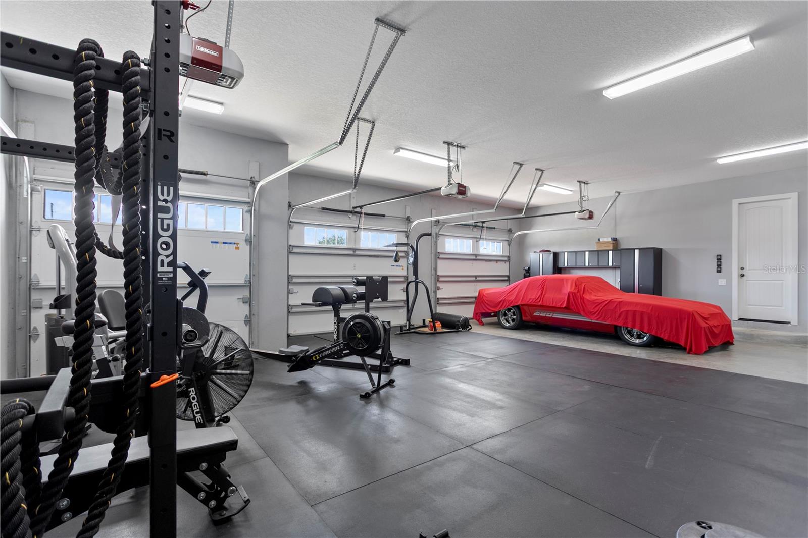 Oversized 3-Car Garage with gym set up!
