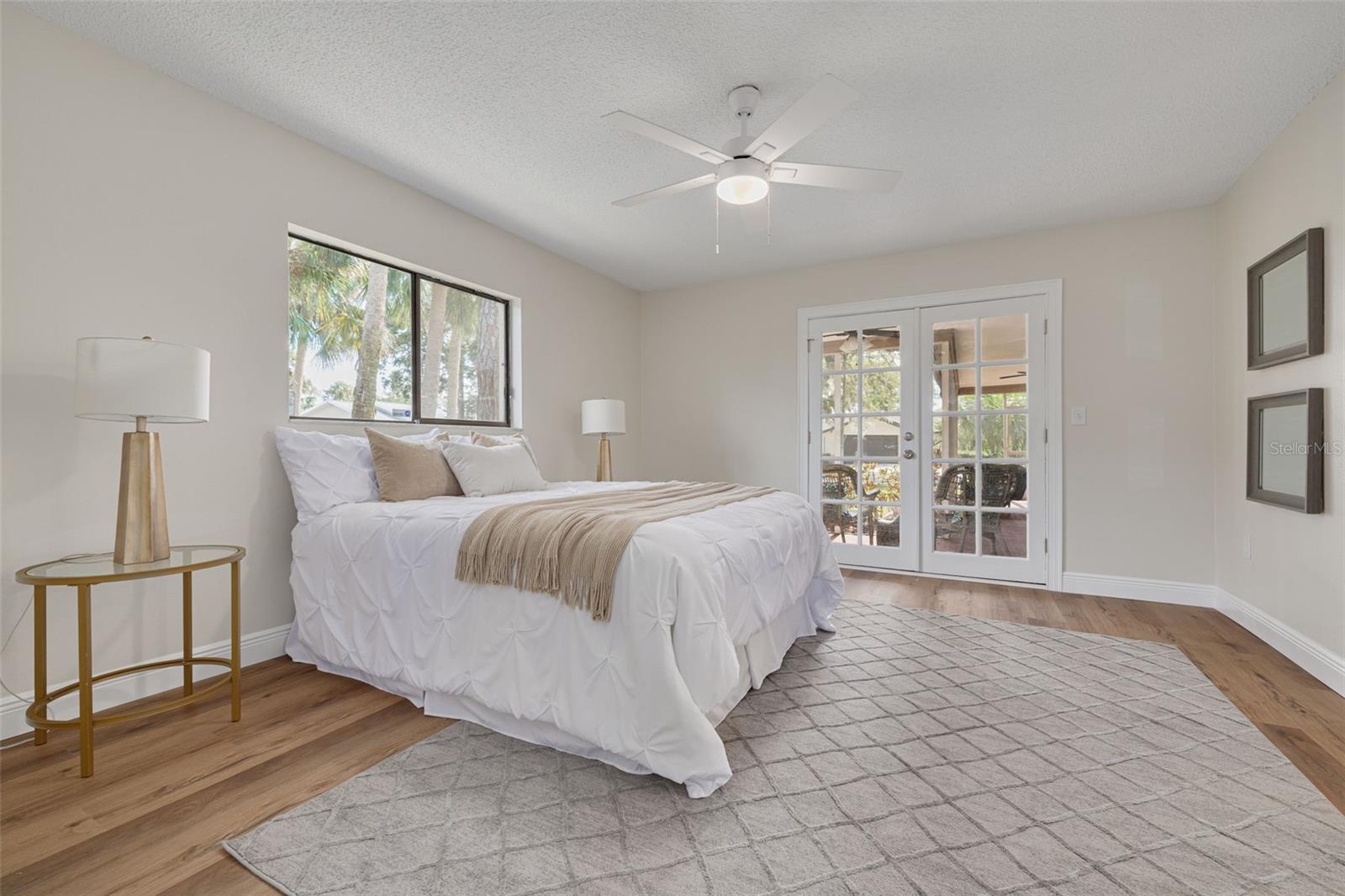 Primary bedroom with French doors to the lanai