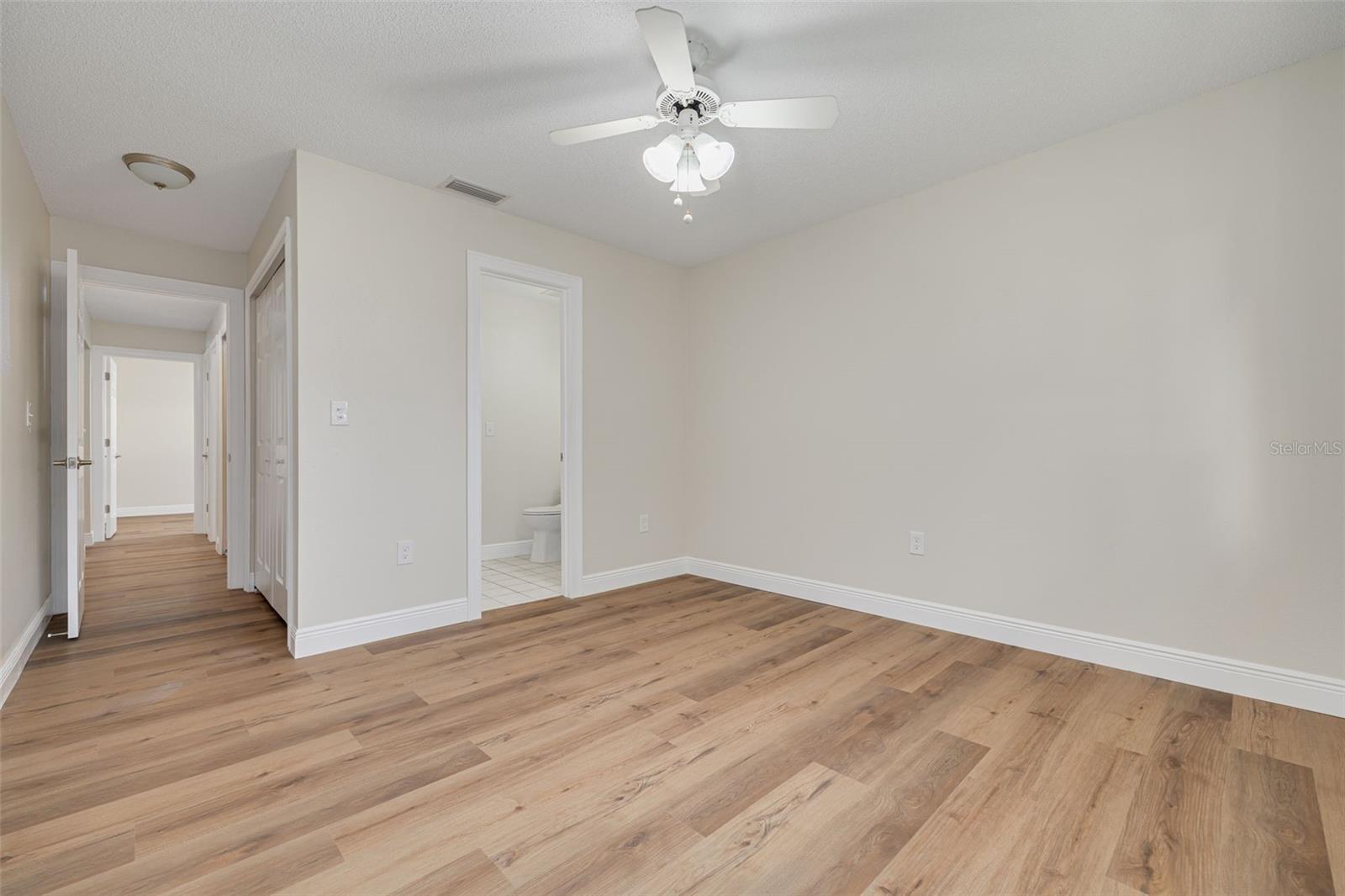 Bedroom #2 with a private sink and commode, and a shared tub/shower