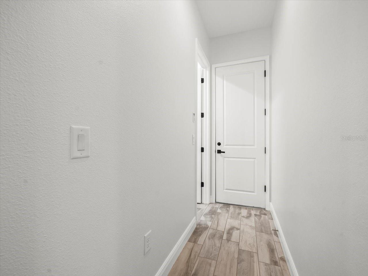 Hall to Laundry Room and 3 Car Garage
