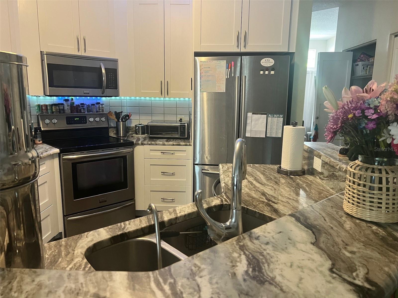 Updated Kitchen with French Door Fridge Ice Maker and Reverse Osmosis  Under Sink