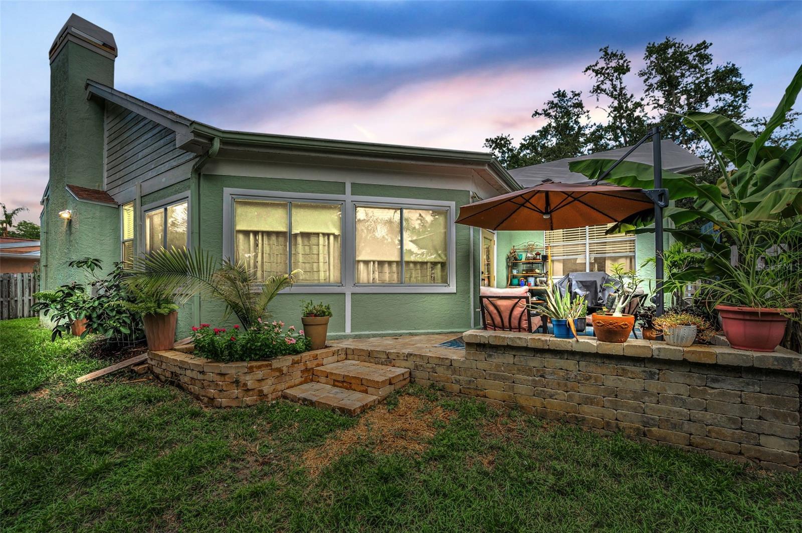 Back corner of yard facing patio