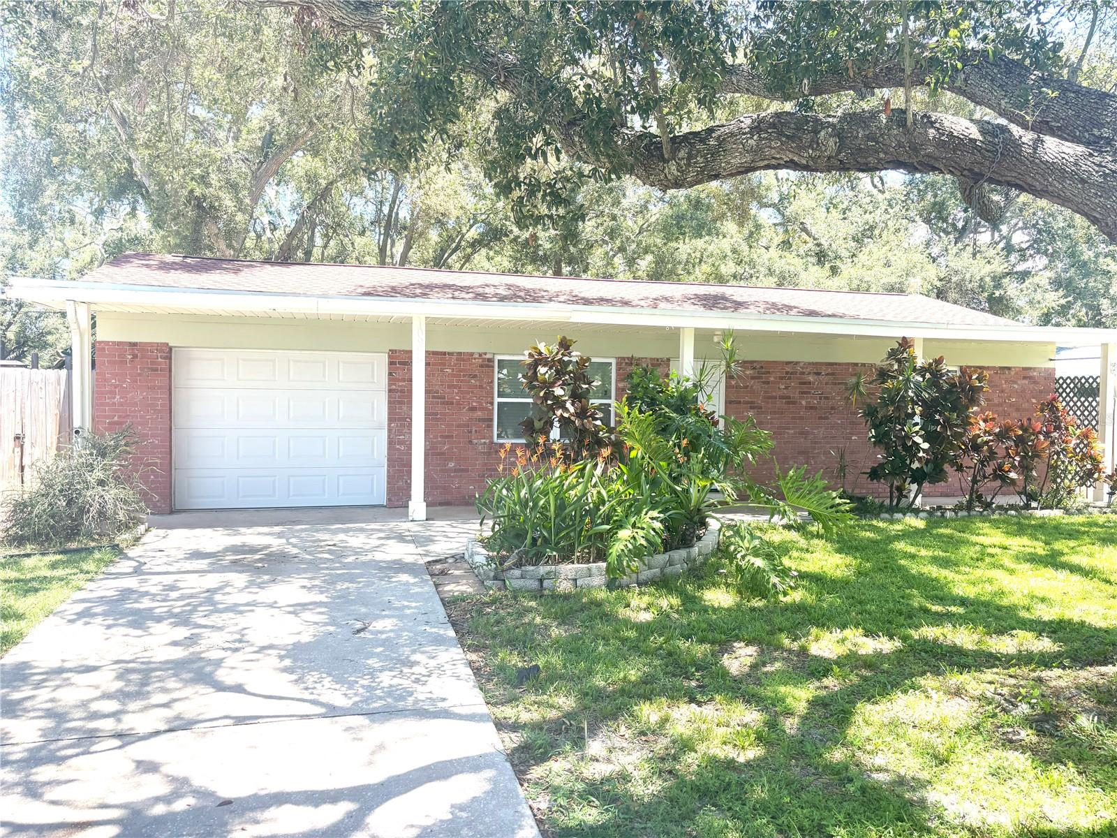 Large shady yard at end of dead end street in convenient loaction just of Seminole Blvd!  1400 plus sq ft of living space whenb including the Enclosed Finished Porch that is 438 SQ ft with a window unit currently.