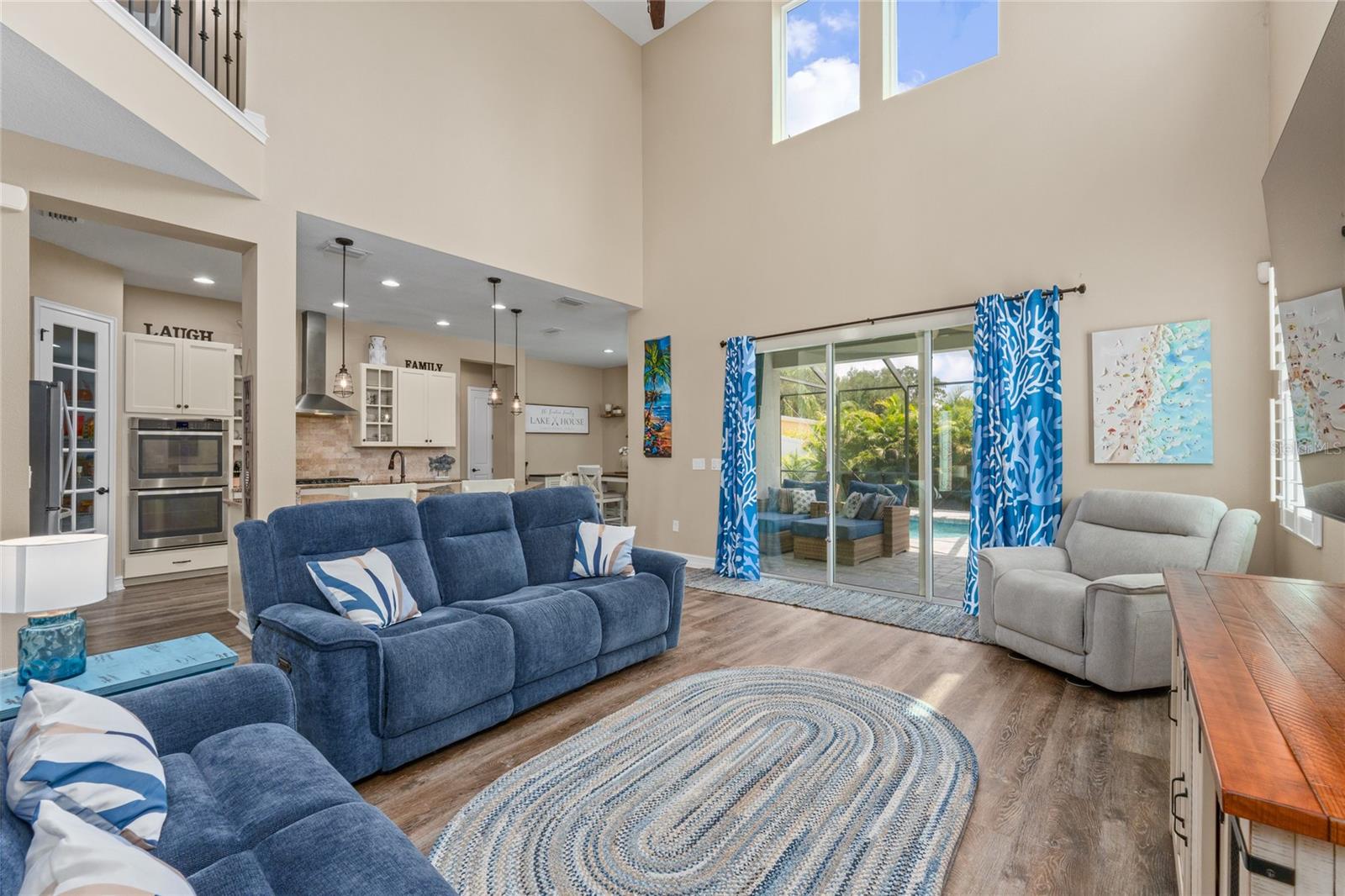 Family room has 20 ft ceilings