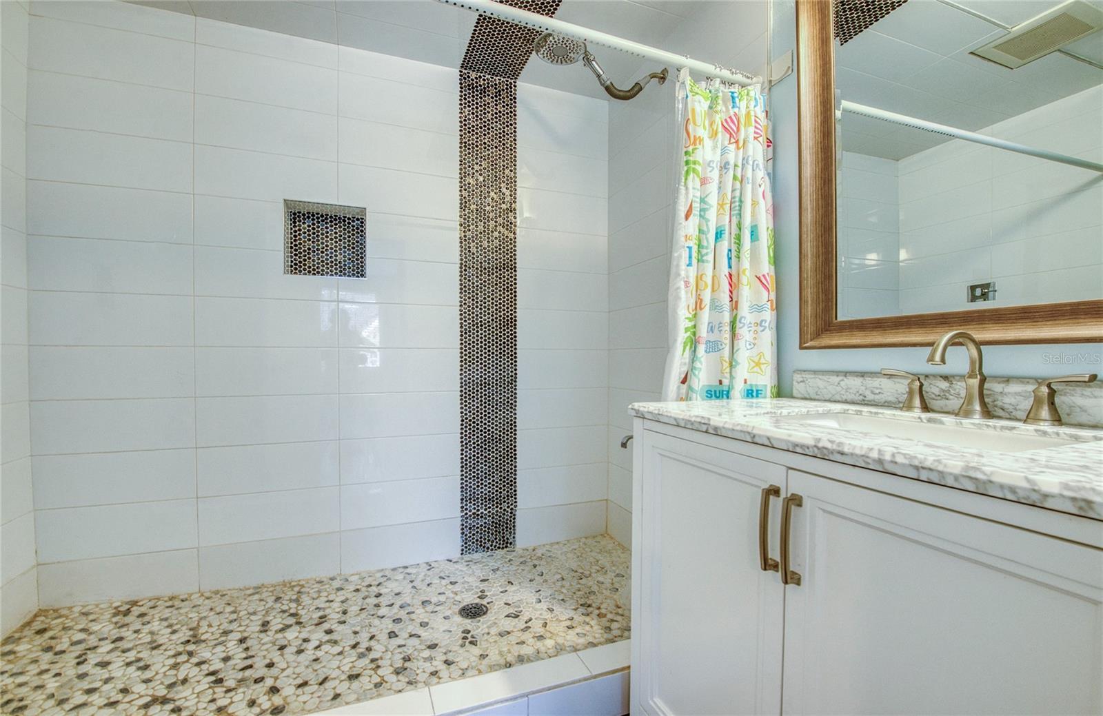 Downstairs bedroom’s full ensuite bathroom