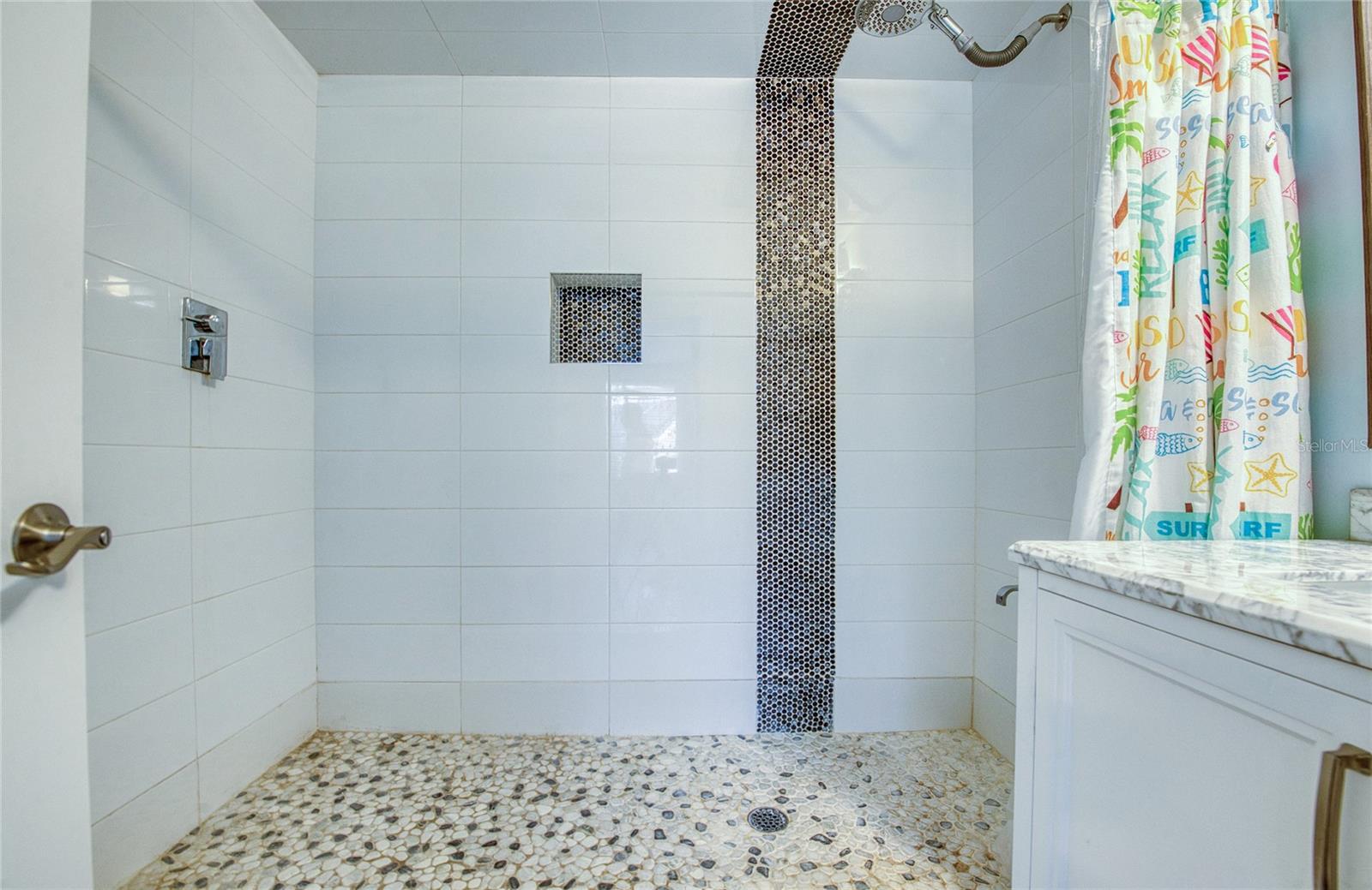 Downstairs bedroom’s full ensuite bathroom