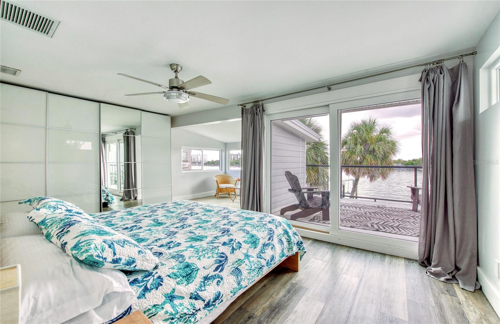 Primary bedroom with private balcony overlooking the intracoastal waters