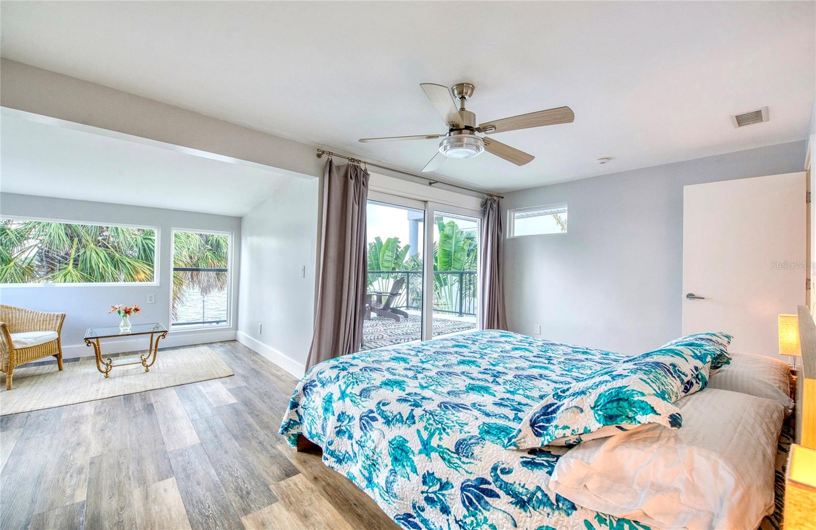 Primary bedroom with private balcony overlooking the intracoastal waters